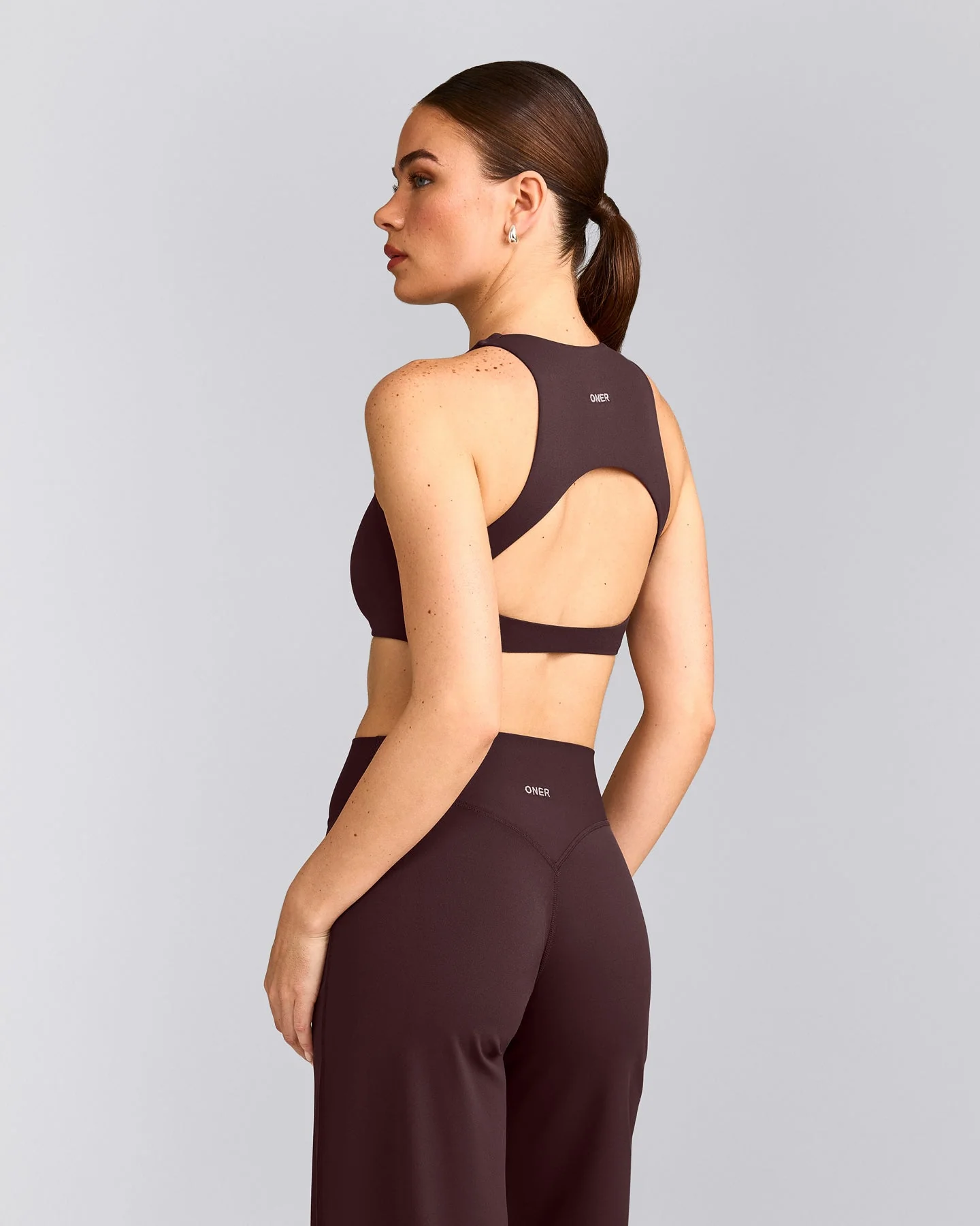 SoftMotion™ High Neck Sports Bra with Grey Logo | Plum Brown