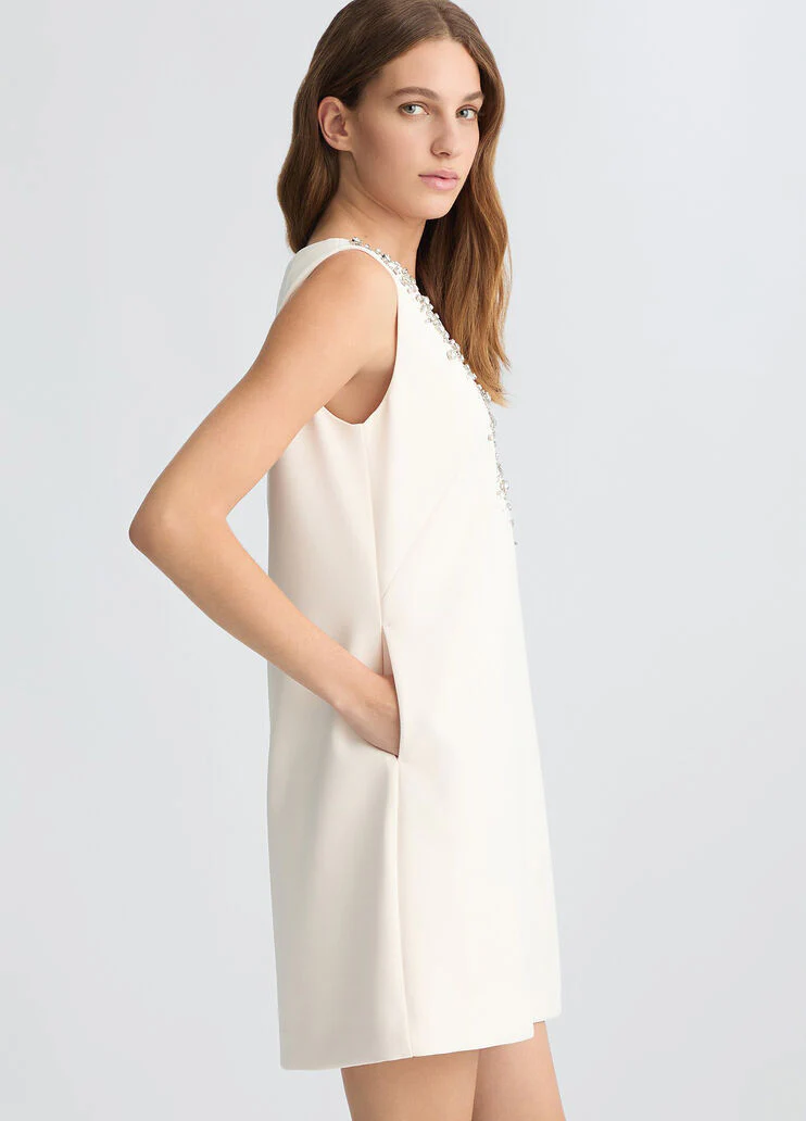 Short champagne-coloured dress with bejewelled embellishment