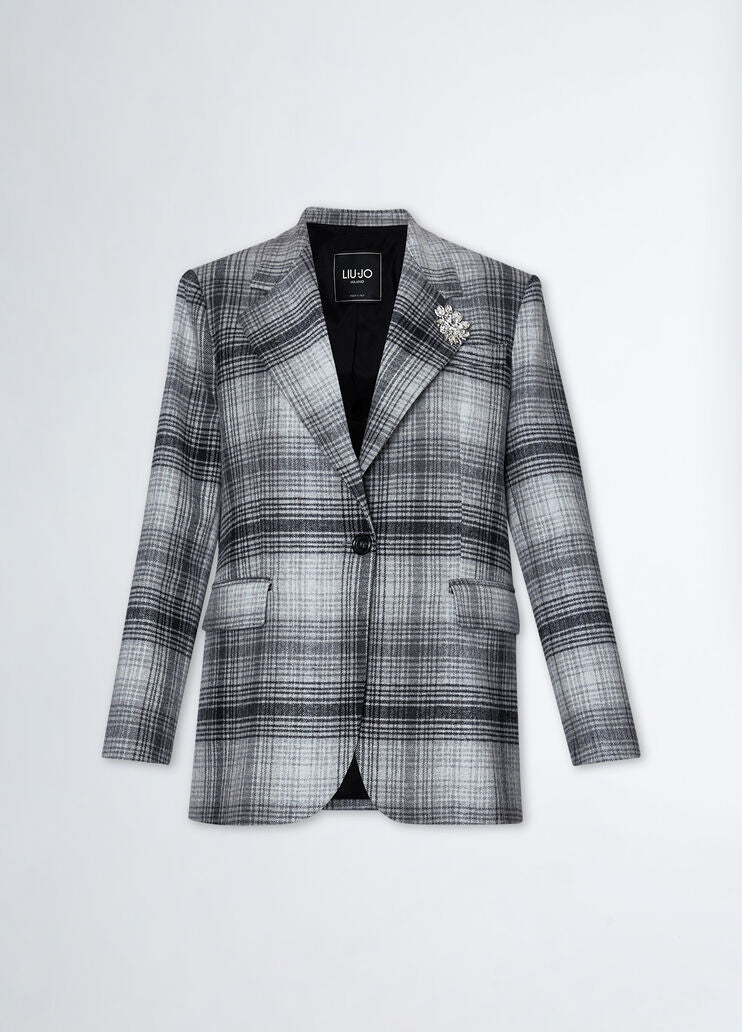 Suit blazer with brooch