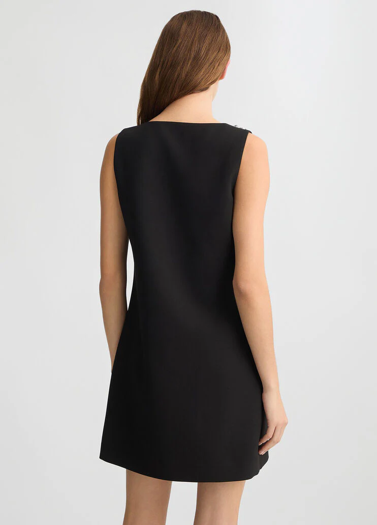 Short black dress with bejewelled embellishment