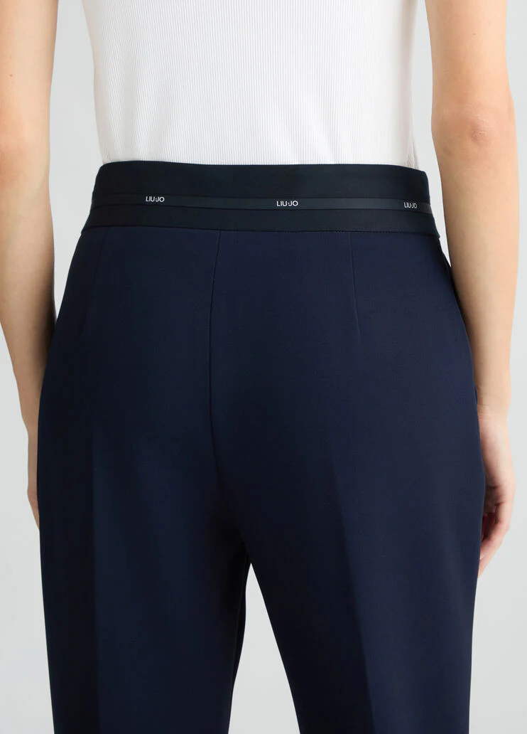 Trousers with branded waistband