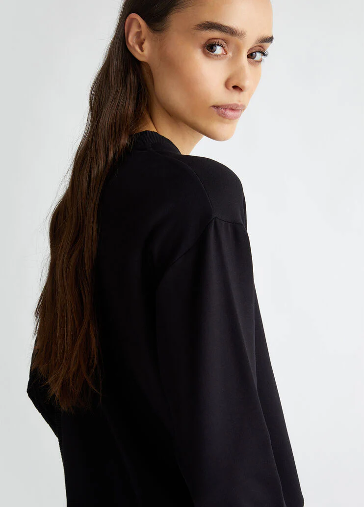 Black sweatshirt with knit insert