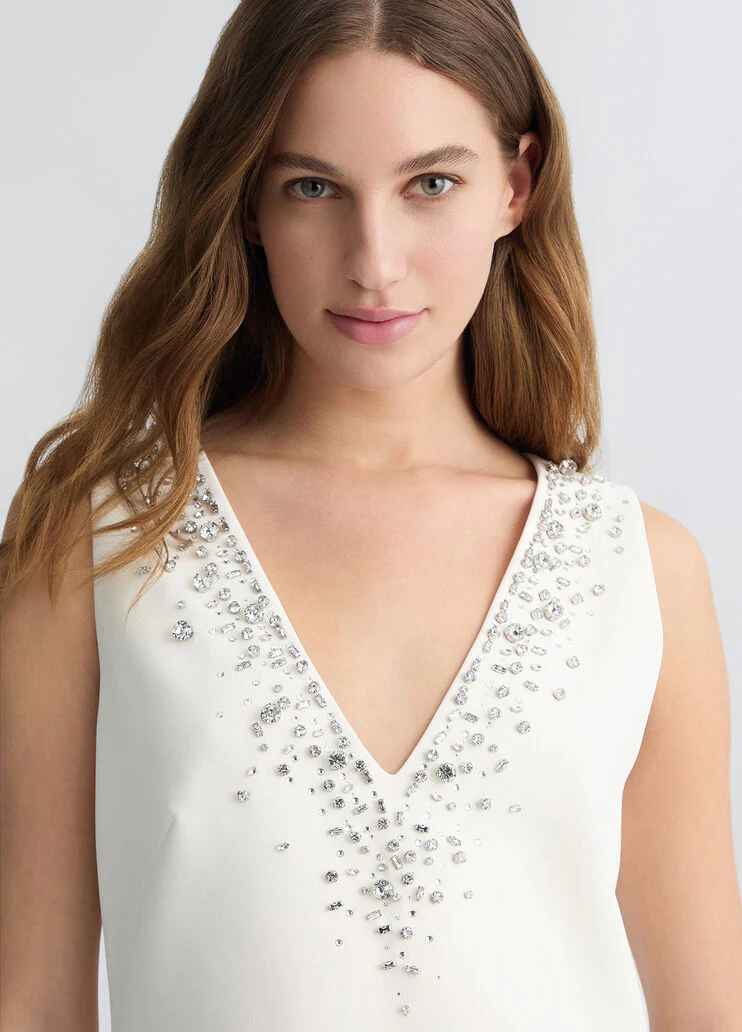 Short champagne-coloured dress with bejewelled embellishment