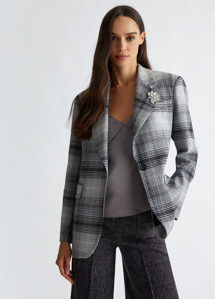 Suit blazer with brooch