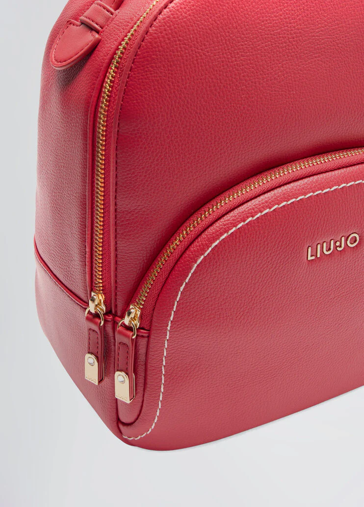 Tumbled backpack with clutch bag