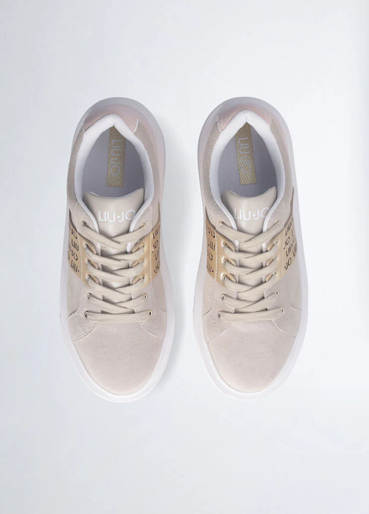 Sneakers with perforated logo