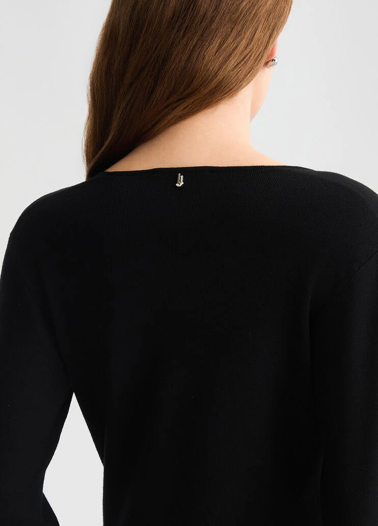 Short black dress with bejewelled embellishment