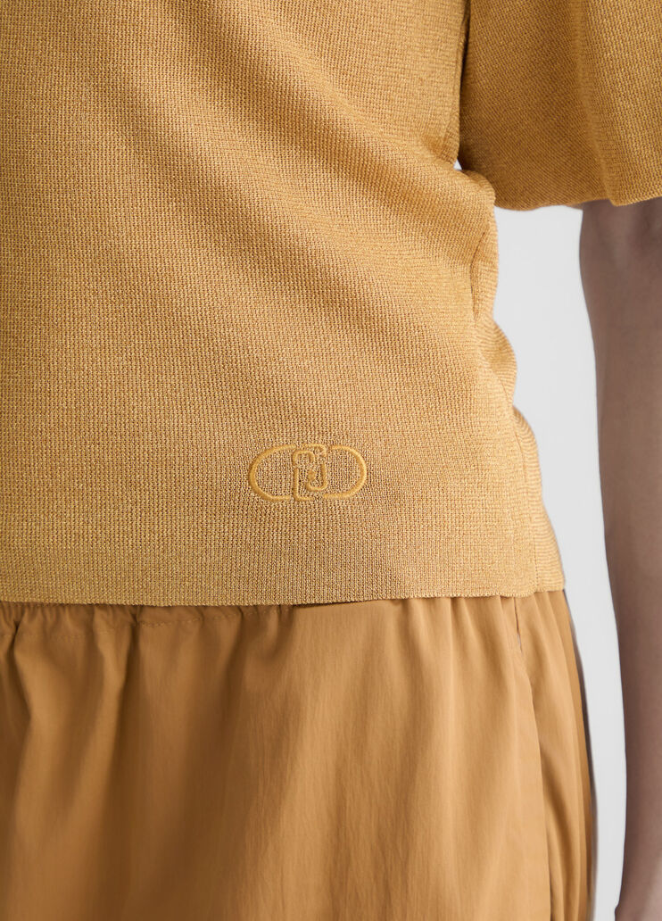 Gold top with cut-out detailing