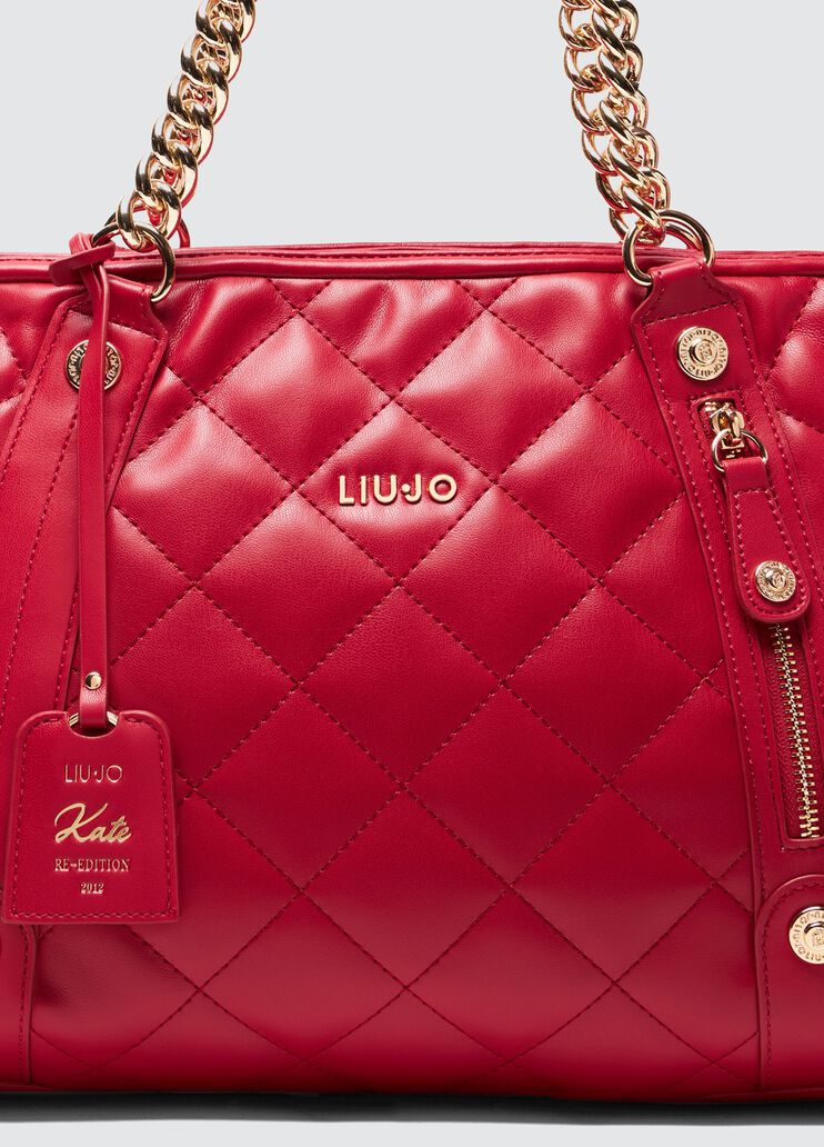 Quilted shopping tote with charm