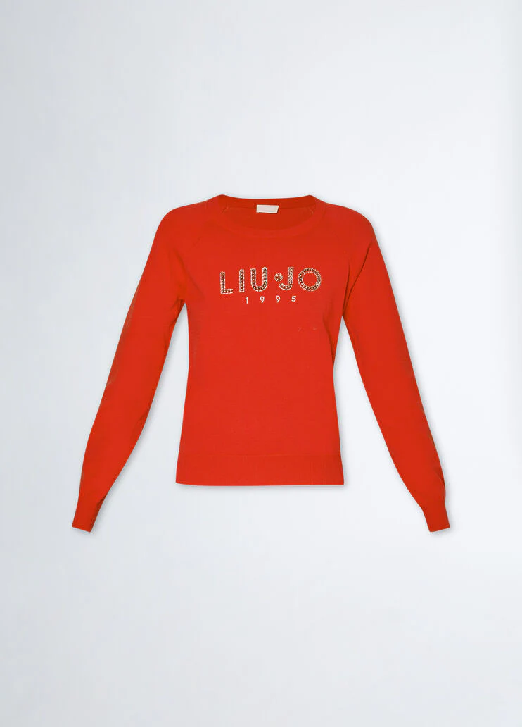 Top with logo and gemstones