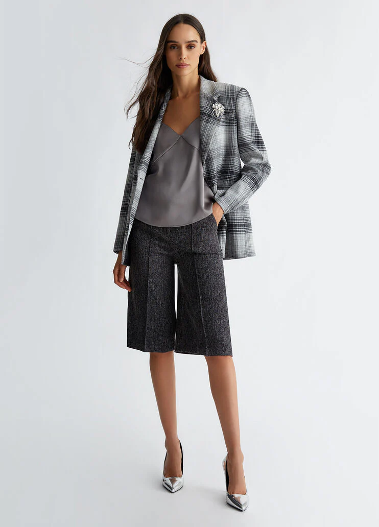 Suit blazer with brooch