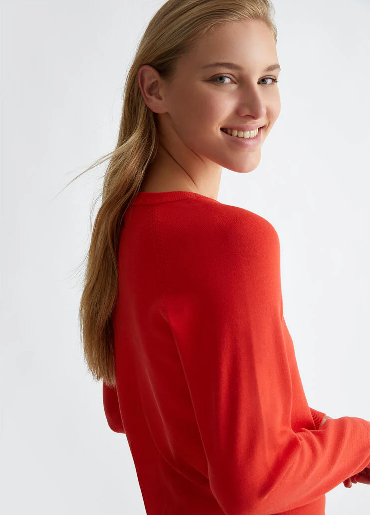 Top with logo and gemstones