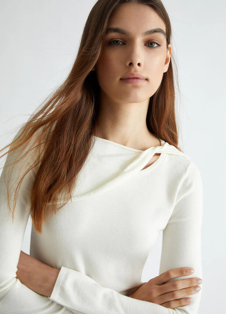 White jumper with cut-out