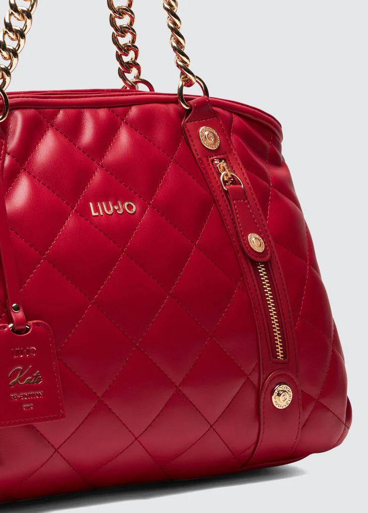 Quilted shopping tote with charm