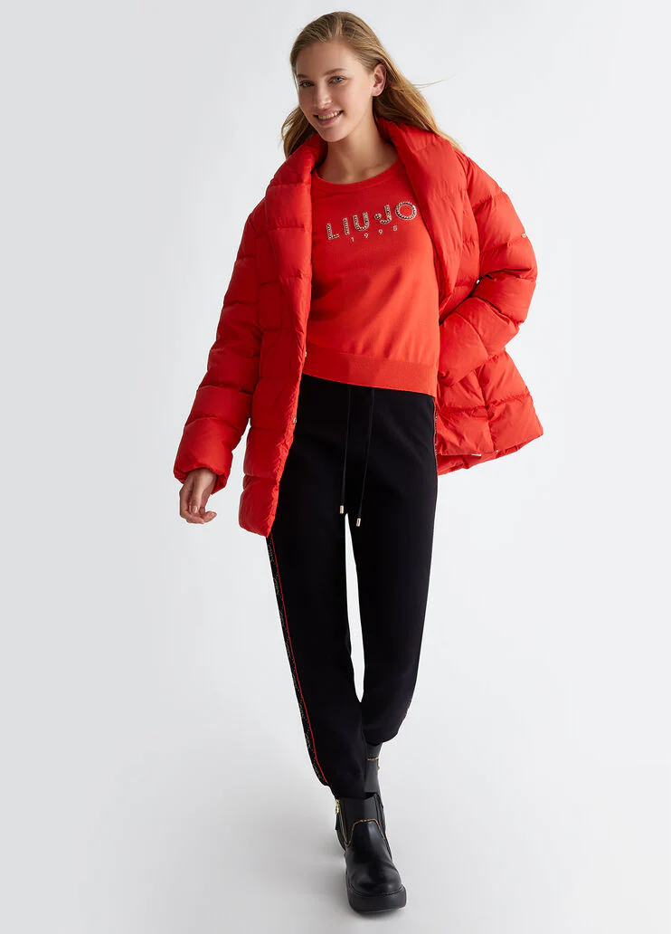 Top with logo and gemstones