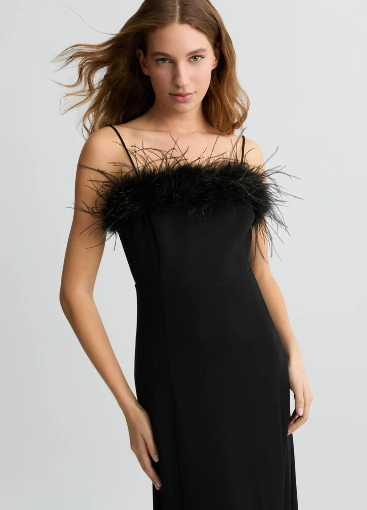 Elegant black dress with feathers