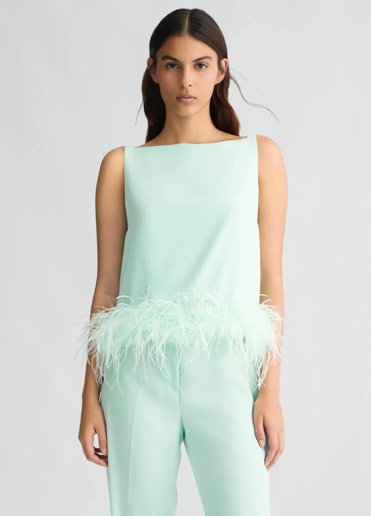 Aqua green top with feathers