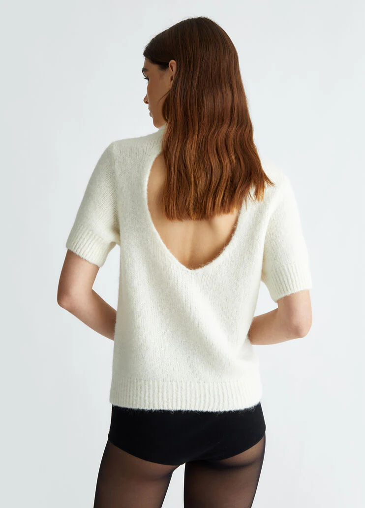 White turtleneck with cut-out