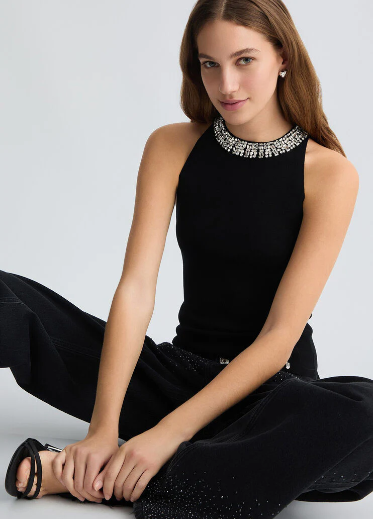 Black top with bejewelled embellishment