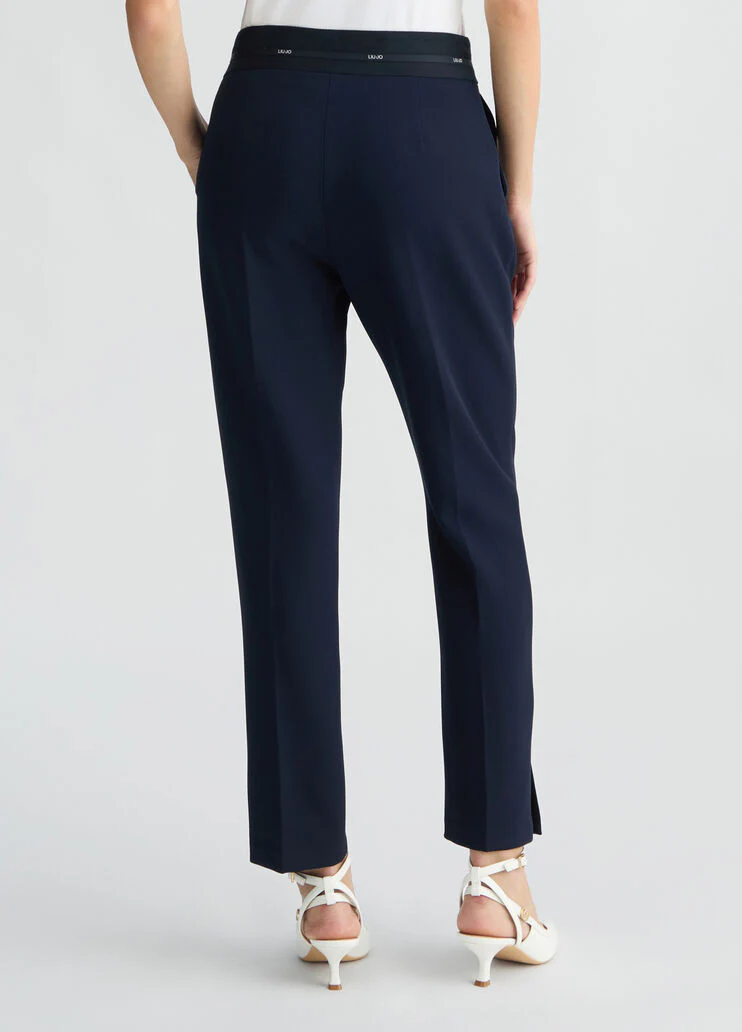 Trousers with branded waistband