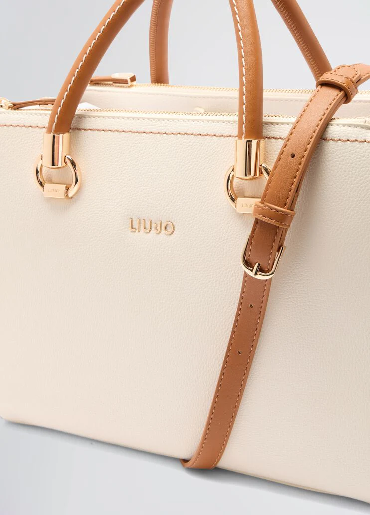 White and brown handbag