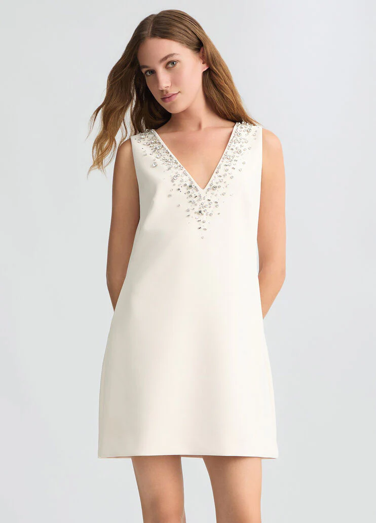 Short champagne-coloured dress with bejewelled embellishment