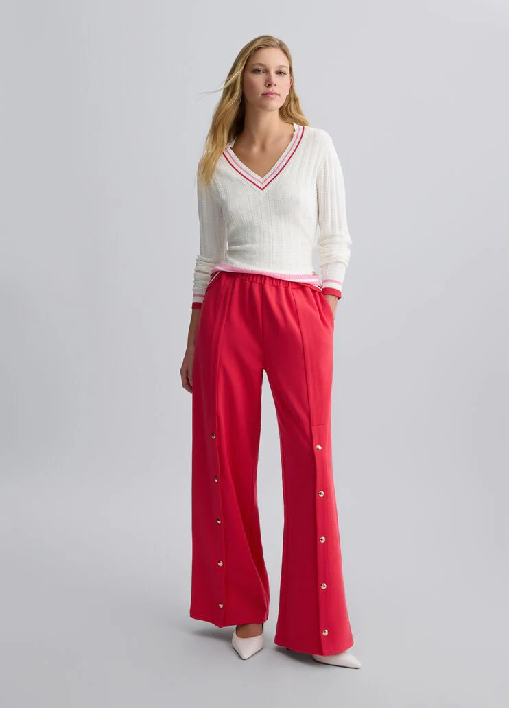 White jumper with colourful stripes