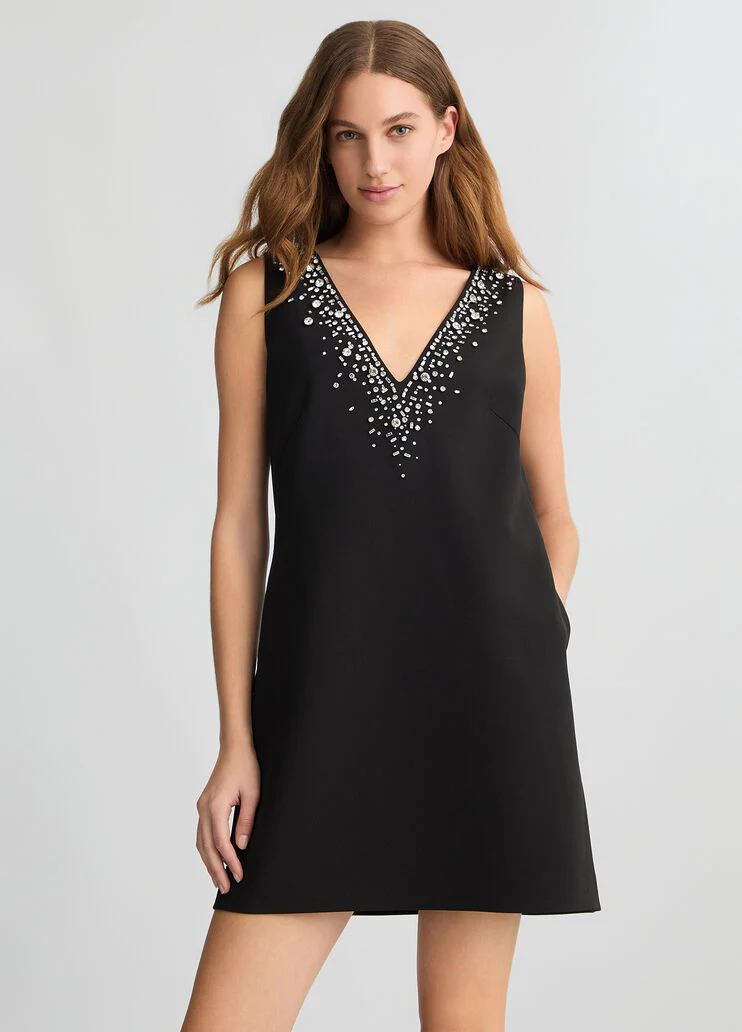 Short black dress with bejewelled embellishment