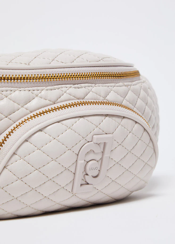 Quilted belt bag with charm
