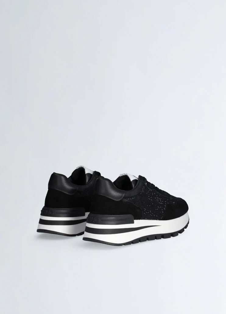 Black sneakers with rhinestone-detailed logo