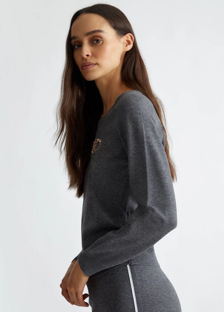 Top with logo and gemstones