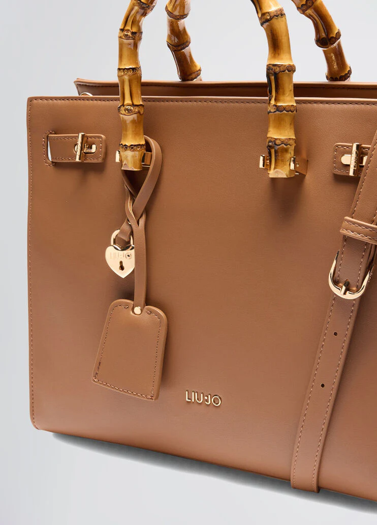 Bag with bamboo-finish handles