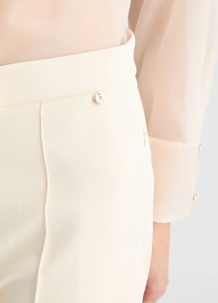 Cream cigarette trousers