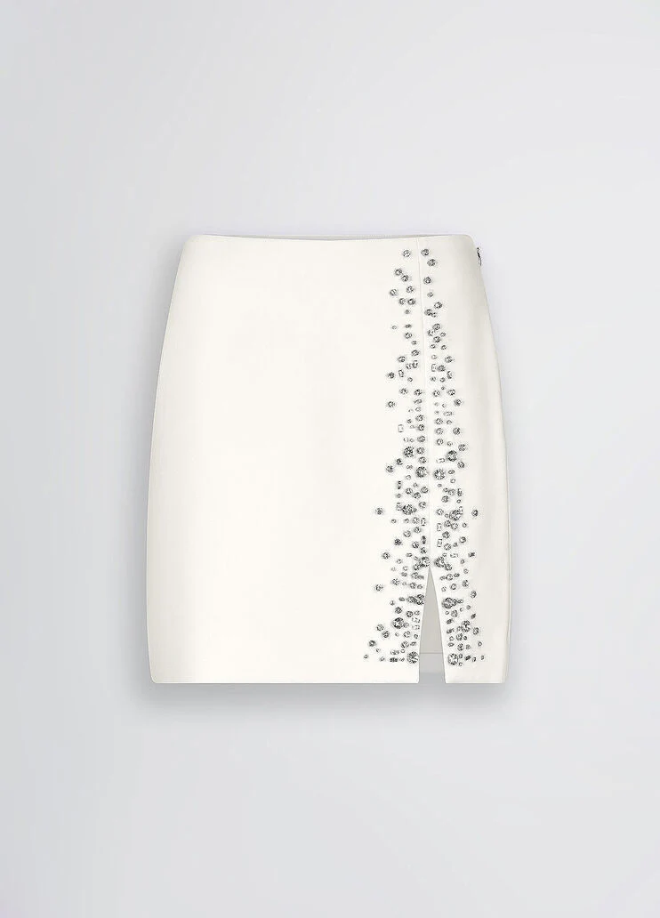White mini skirt with bejewelled embellishment