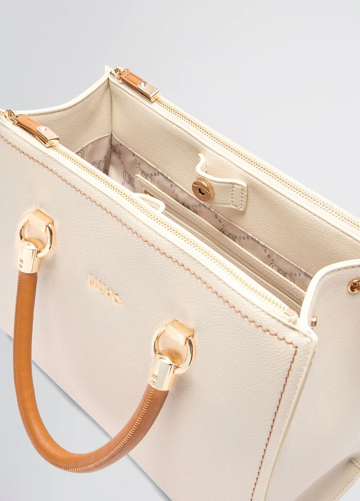 White and brown handbag