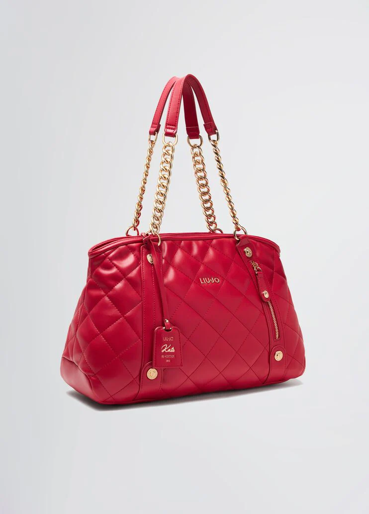 Quilted shopping tote with charm