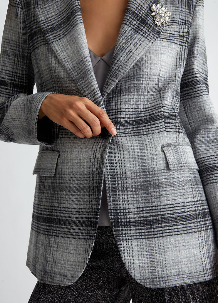 Suit blazer with brooch