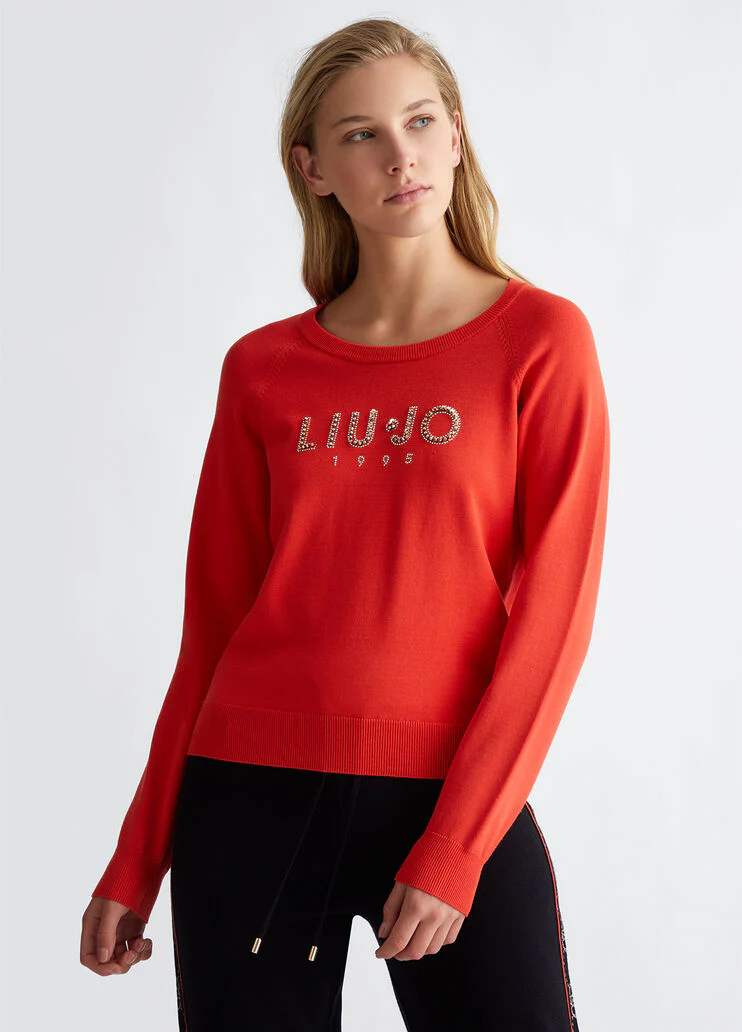 Top with logo and gemstones