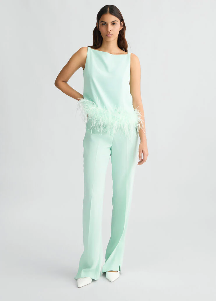 Aqua green top with feathers