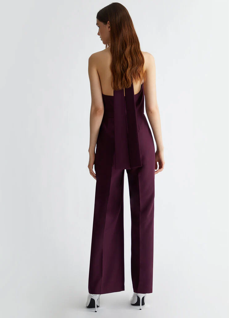 Stretch jumpsuit with pussy-bow