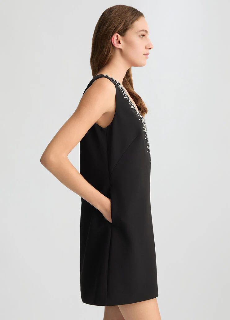 Short black dress with bejewelled embellishment