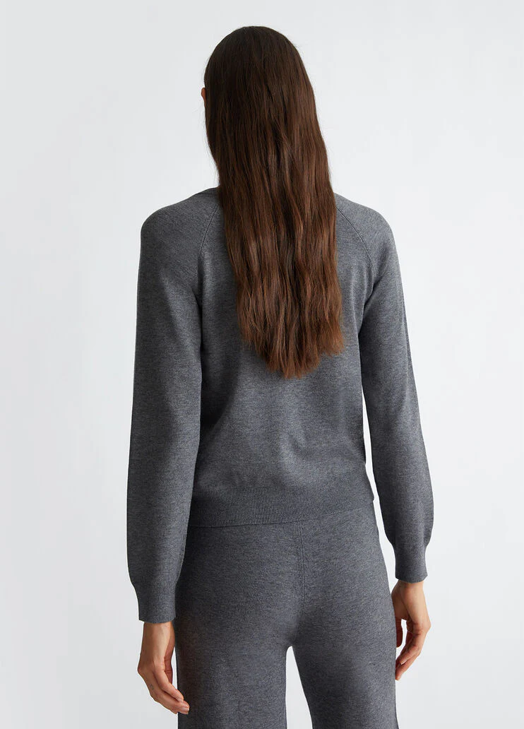 Top with logo and gemstones