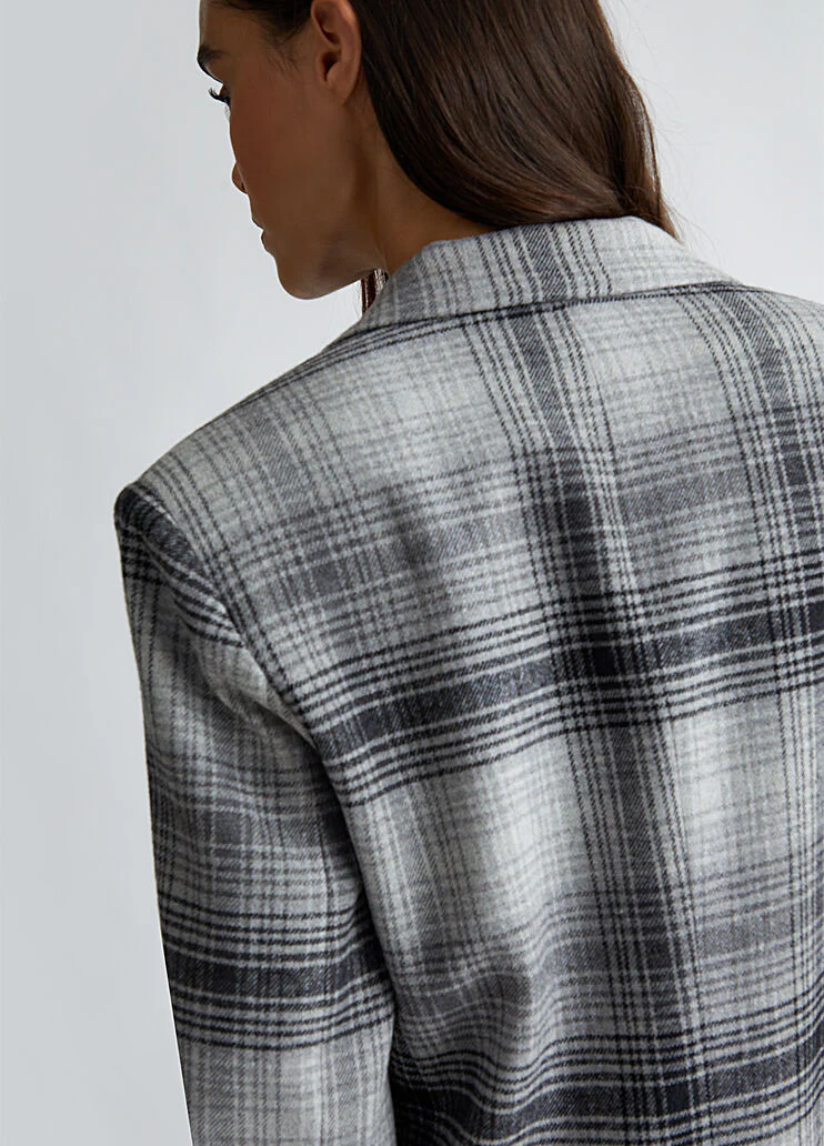 Suit blazer with brooch