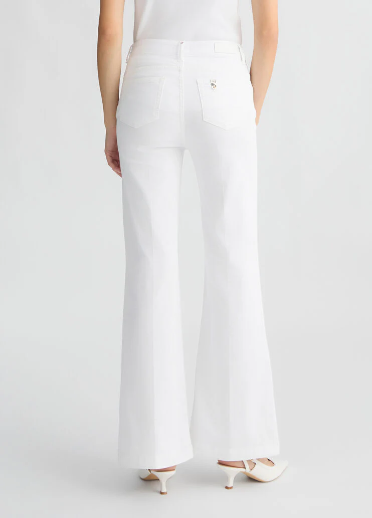 Flared trousers with buttons