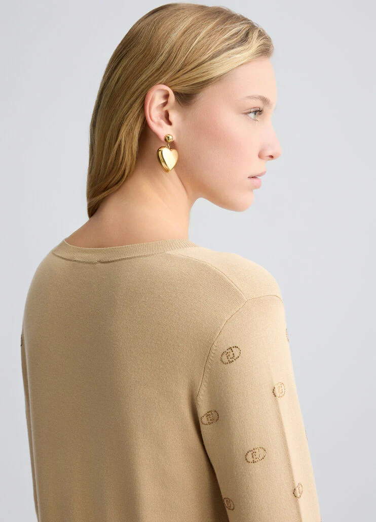 Top with logo and gemstones