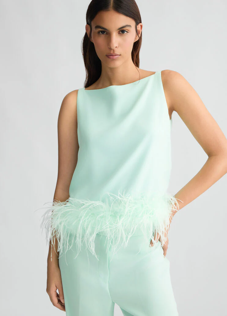 Aqua green top with feathers