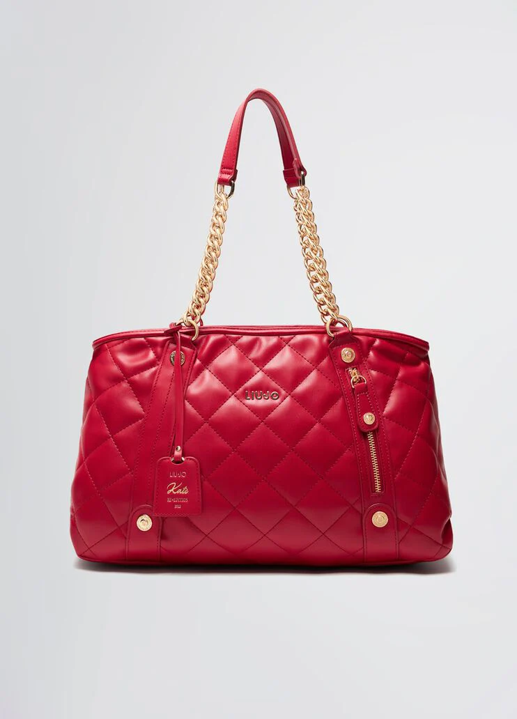 Quilted shopping tote with charm