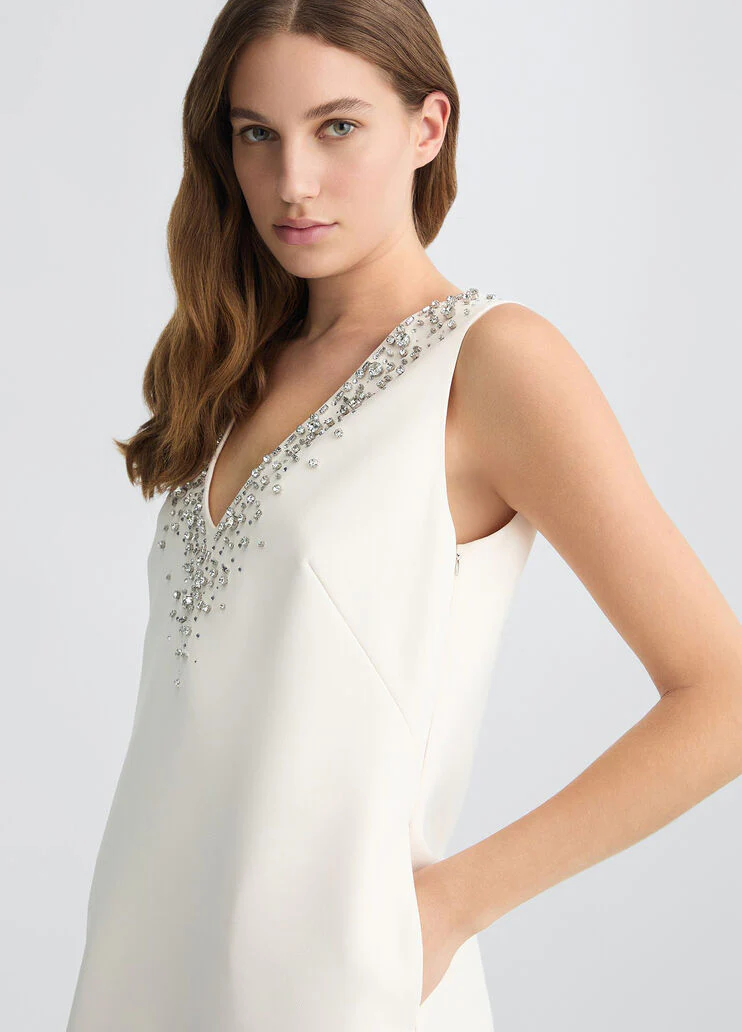 Short champagne-coloured dress with bejewelled embellishment
