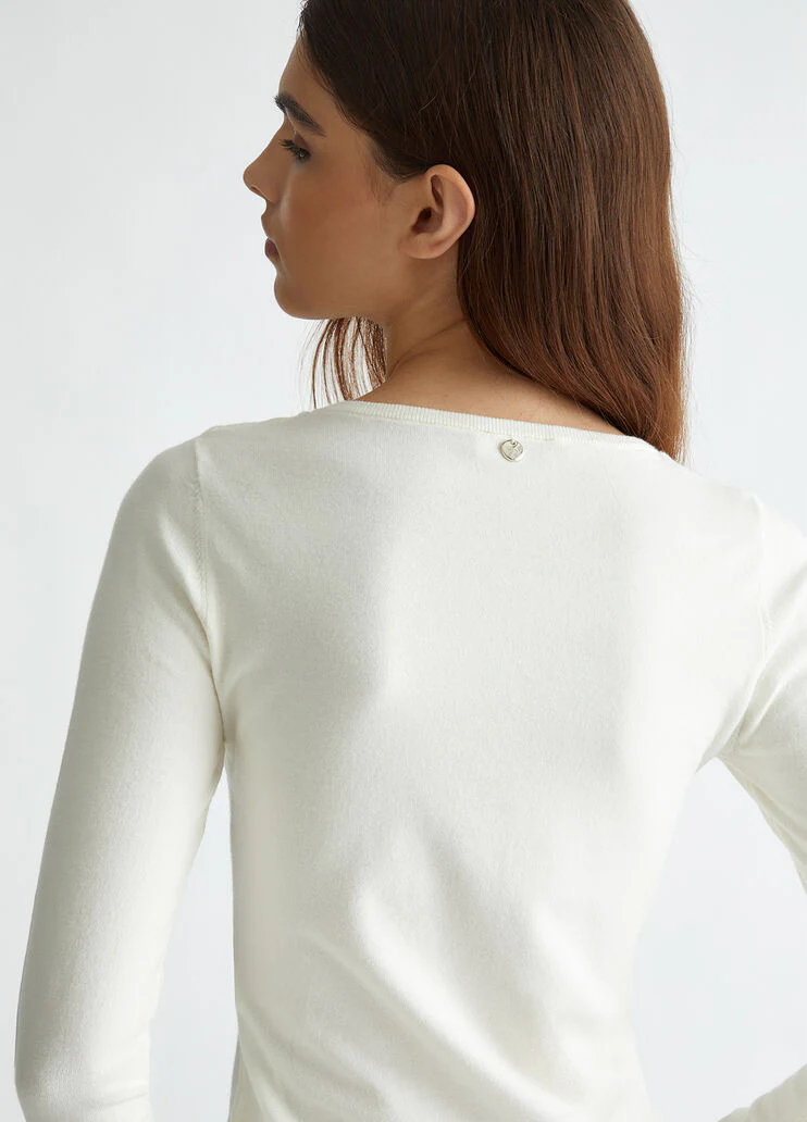 White jumper with cut-out