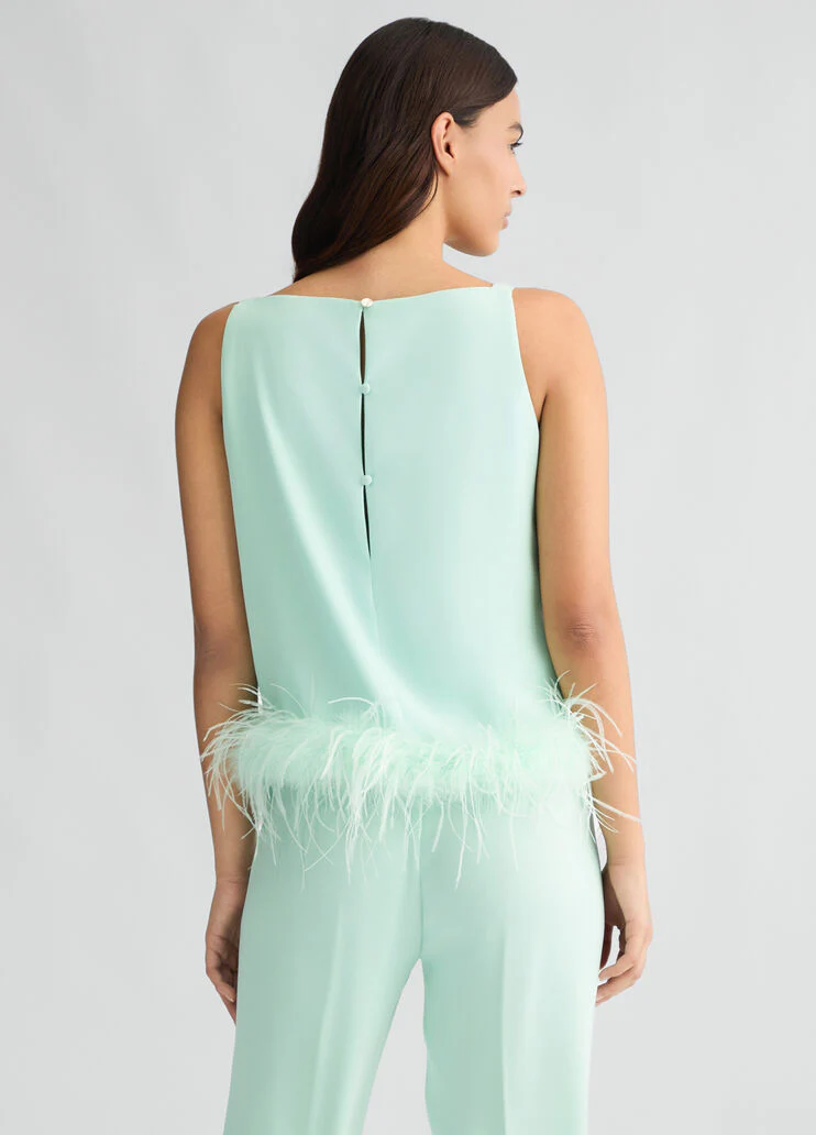 Aqua green top with feathers